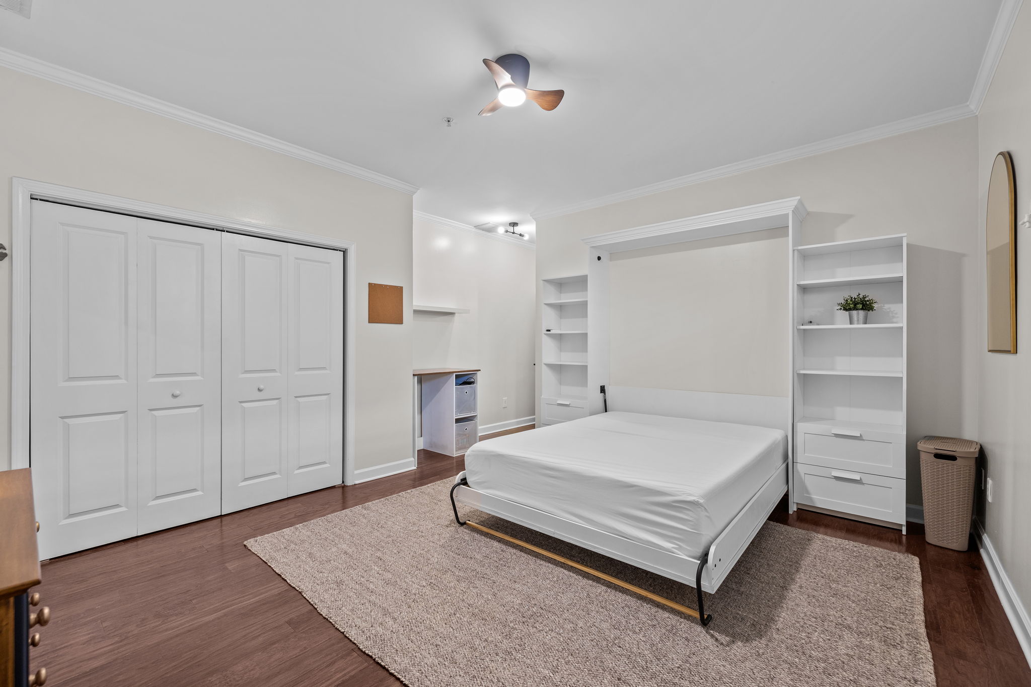 Murphy bed stored away as office space