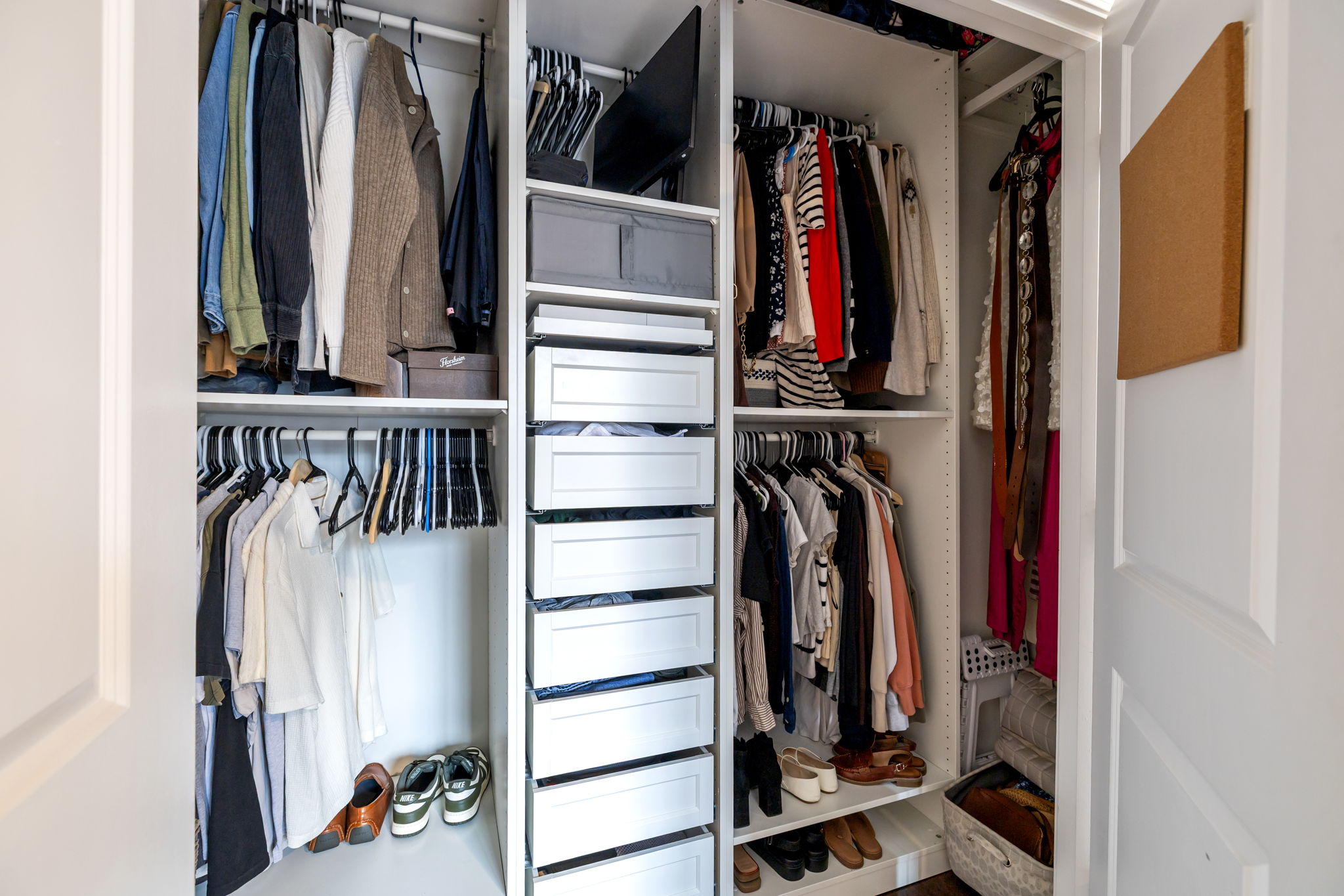 Walk-in closet with full wardrobe organization