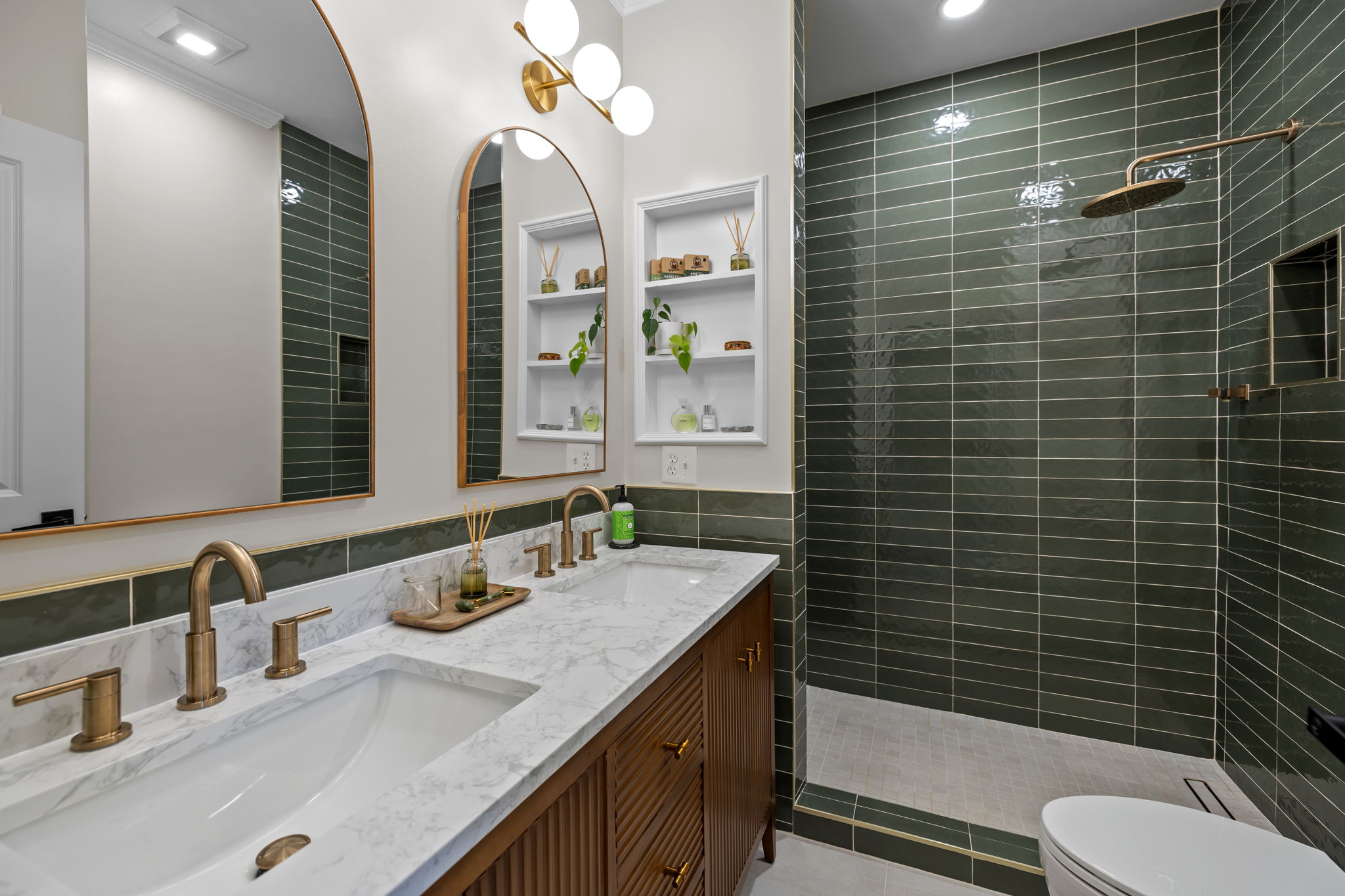 Remodeled bathroom with dual vanity and walk-in shower